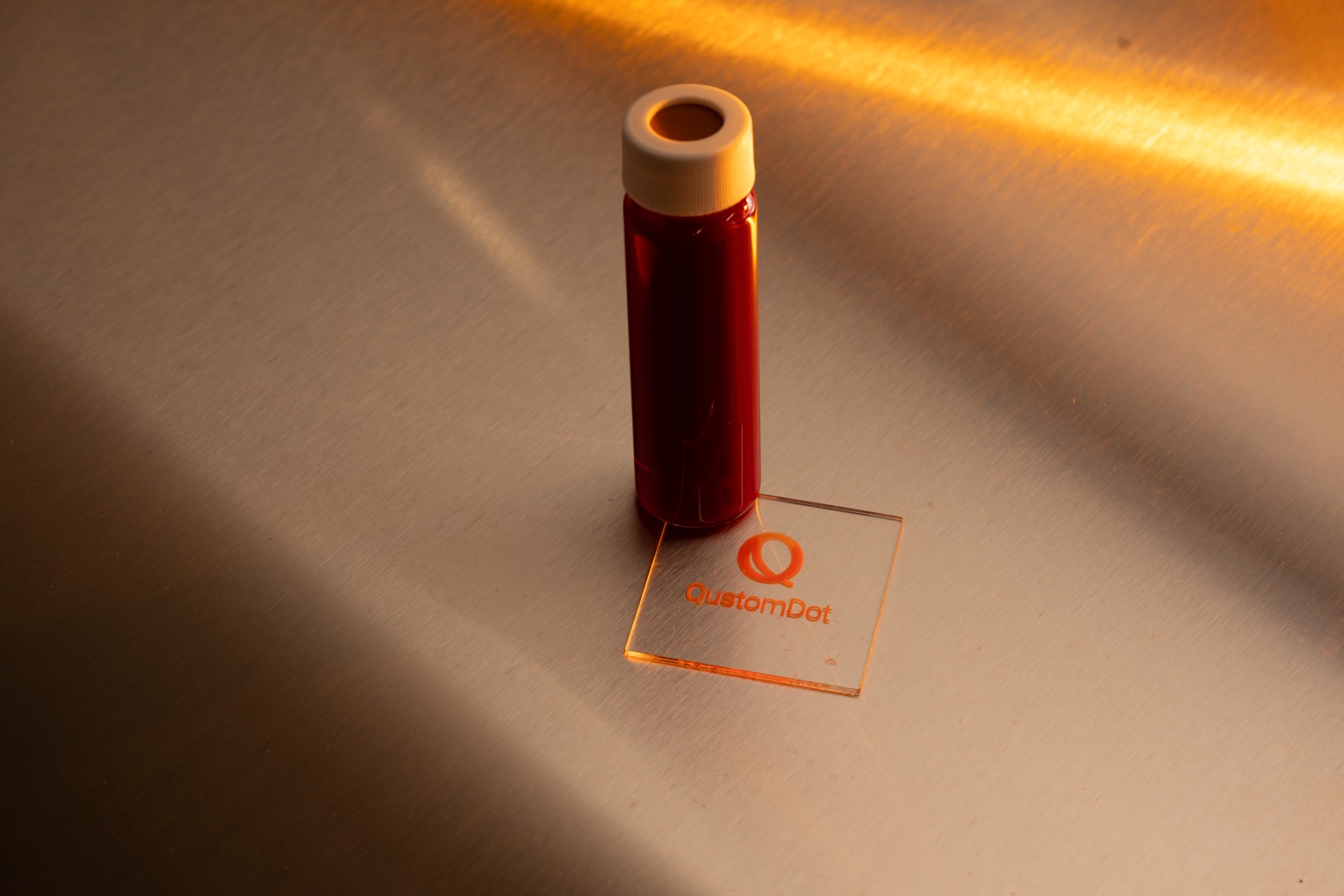 QustomJet™ ink beside a QustomDot colour-conversion sample
